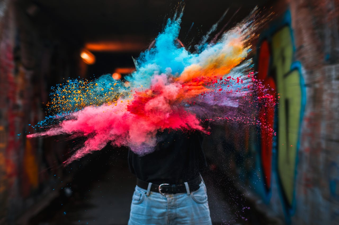 Mastering the First Impression: Your intriguing post title goes here Vibrant powder explosion highlighting colorful creative expression with urban graffiti backdrop.
